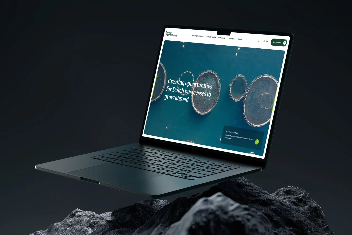 Macbook mockup with Invest International website